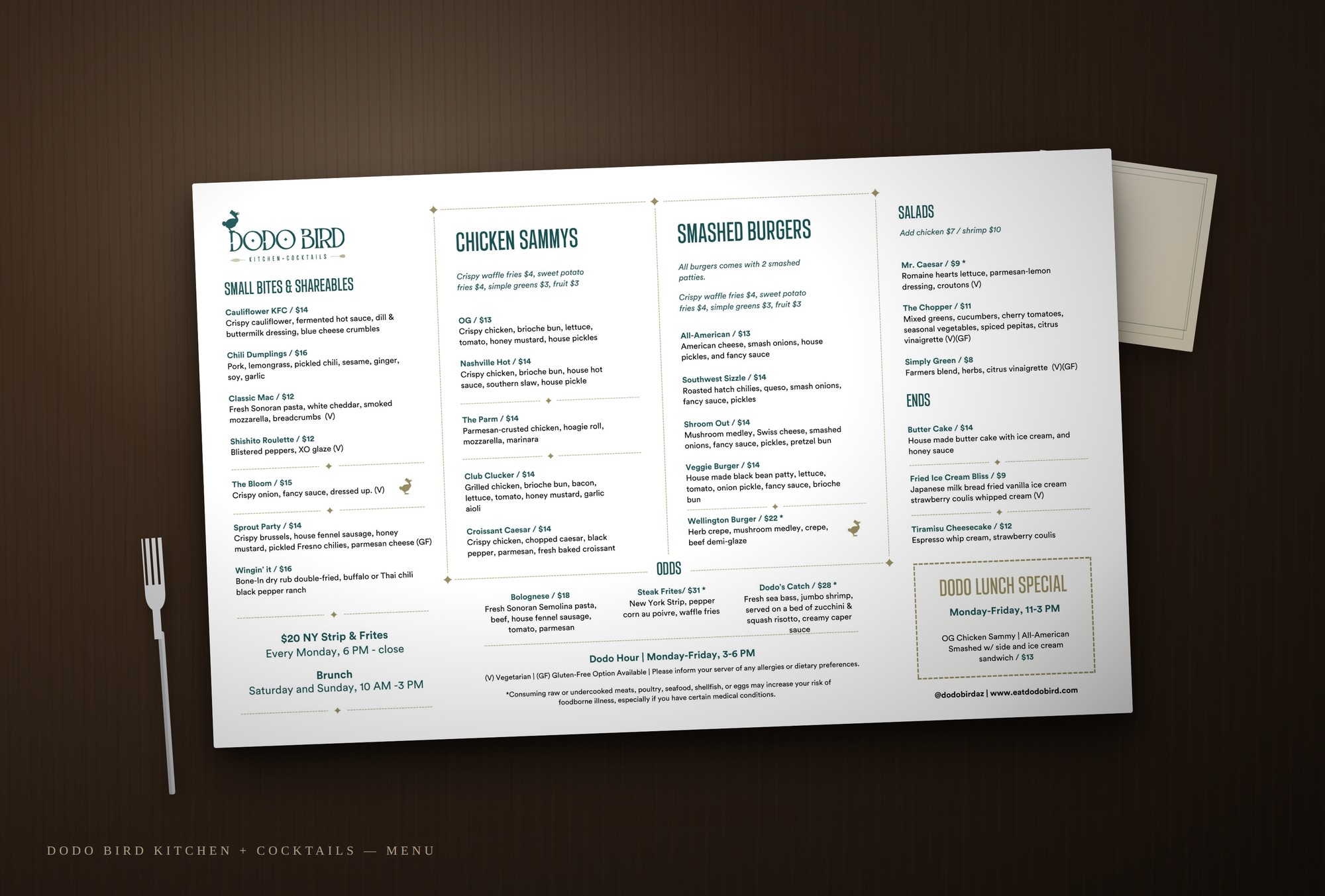 Mockup of the printed DodoBird kitchen and cocktails menu on a restaurant table